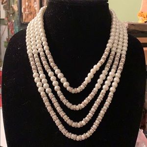 Multi strand faux pearls with rhinestones